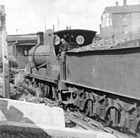 A view of a somewhat battered LYR A class 52443 in the shunting neck outside The Directors pub Heywood Road. RS Greenwood